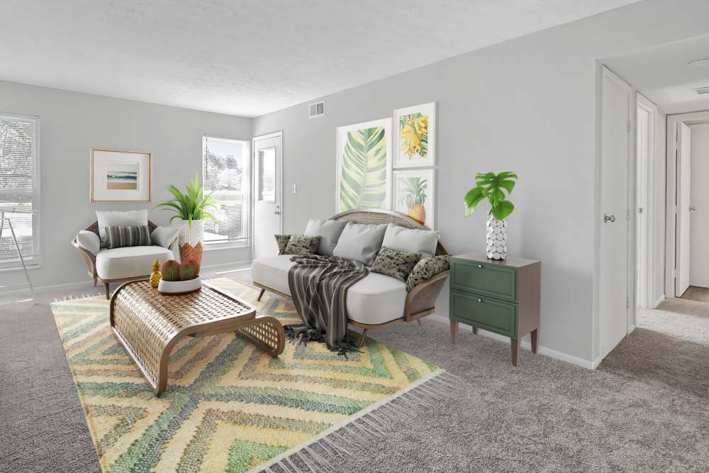 Living room with modern furnishing and carpet flooring at Eden at Jefferson Crossing in Columbus, Ohio