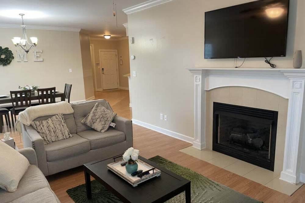 Living room with view to dining area at Amelia Apartments in Fayetteville, North Carolina