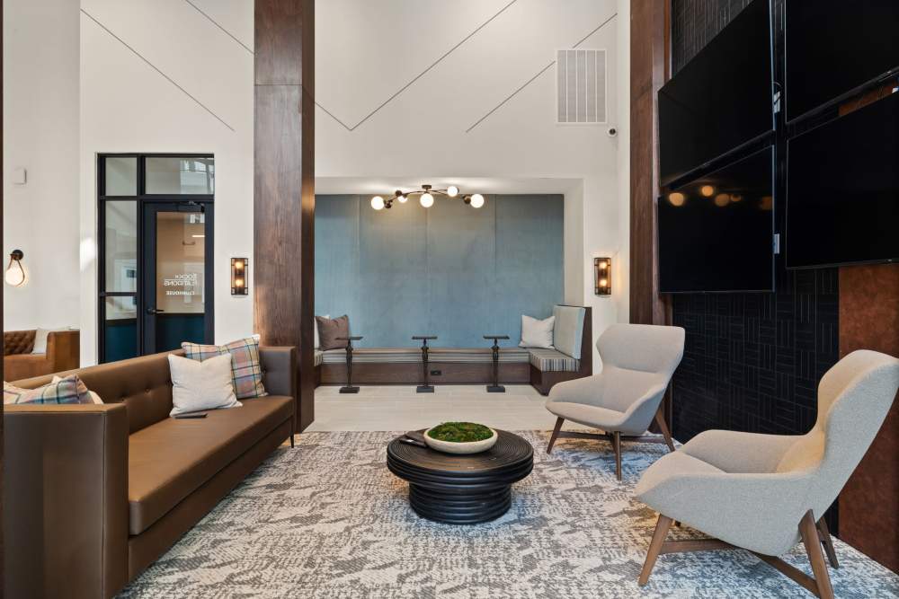 Community clubhouse with lounge seating at The Lock at Flatirons in Broomfield, Colorado