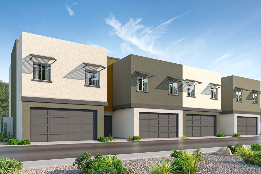Community exterior view with garage at Villas at 91st in Tolleson, Arizona