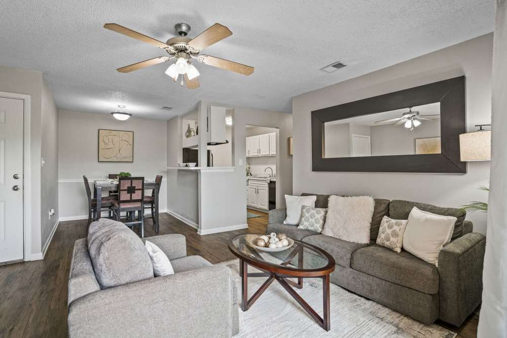 Open floor plan apartment with living room and dining area at Waterstone At Carrollwood in Tampa, Florida