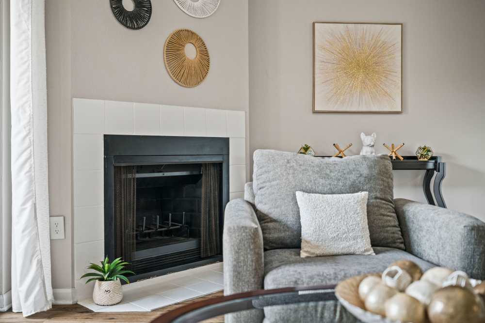 Model living space looking towards a fireplace at Waterstone At Carrollwood in Tampa, Florida