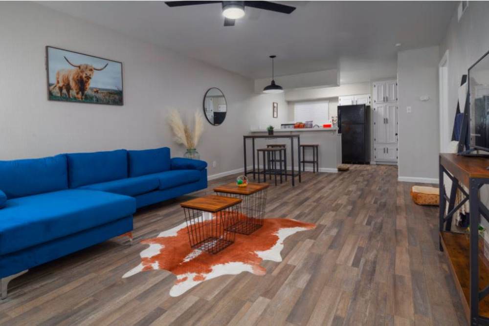 Spacious living room with wood-style flooring at Flats On Wakefield in San Antonio,Texas