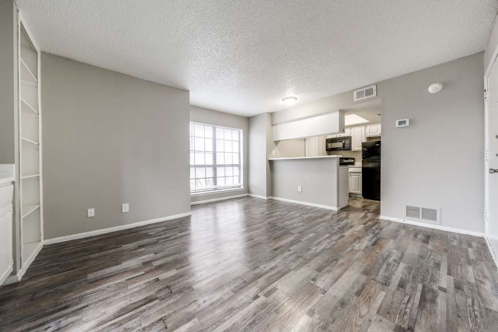 Unfurnished living room with wood-style flooring at Icon Apartments in San Antonio,Texas