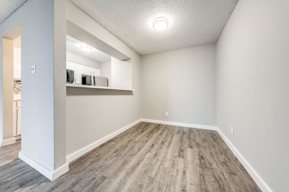 Unfurnished apartment area with kitchen on the left at Icon Apartments in San Antonio, Texas