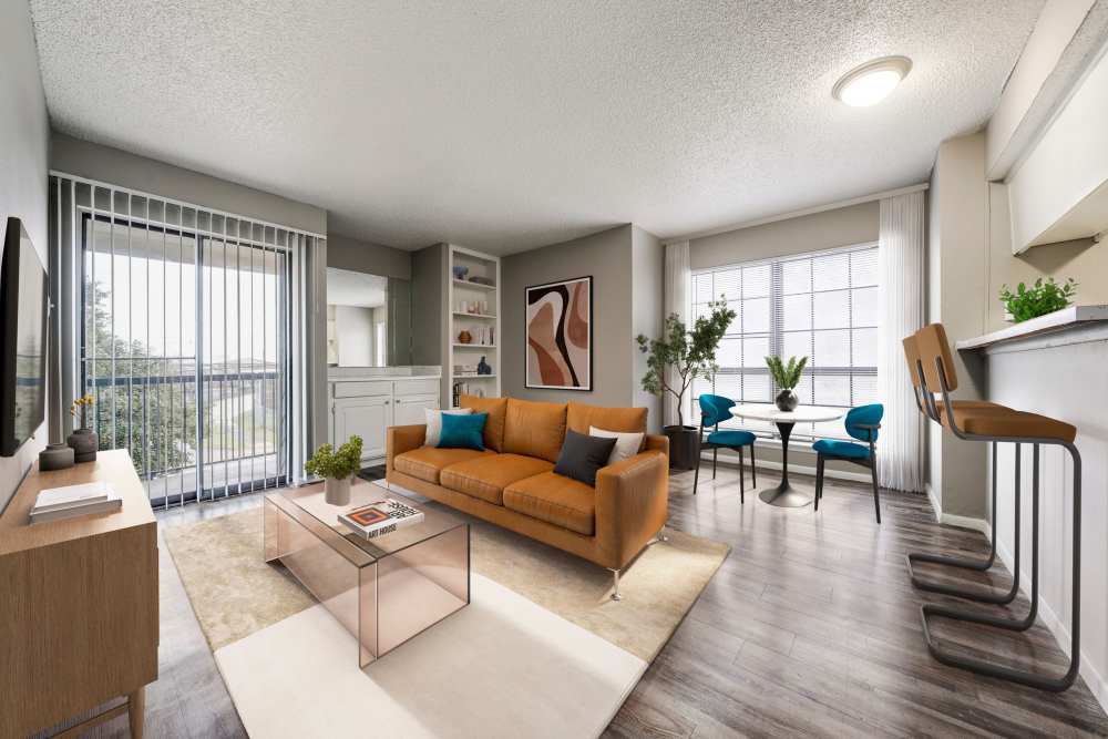 Spacious living room with wood-style flooring at Icon Apartments in San Antonio,Texas