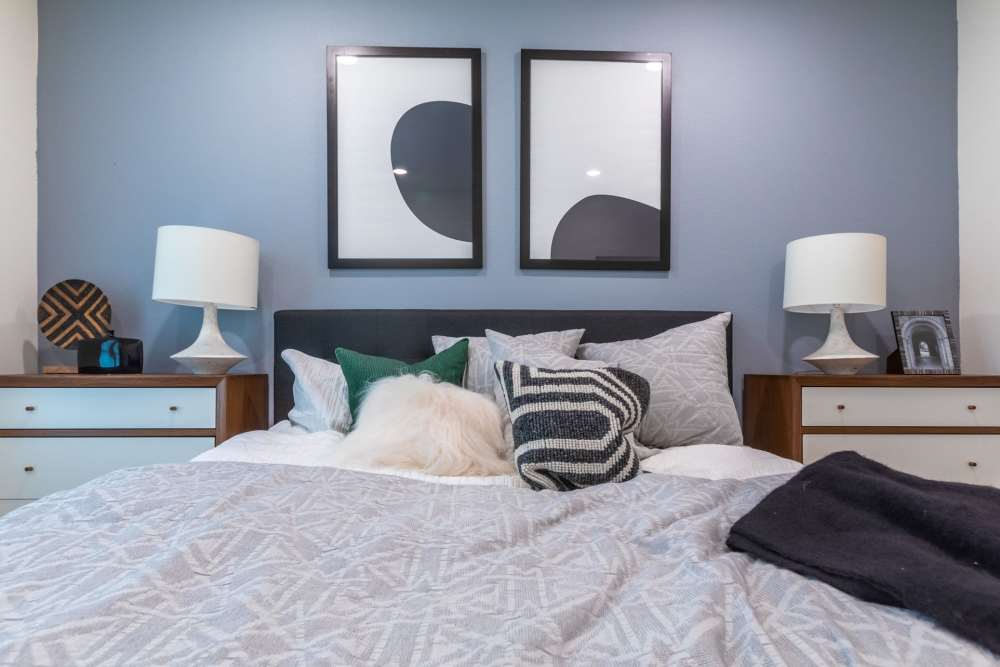 Cozy bed in a bedroom at The Fields in Milpitas, California