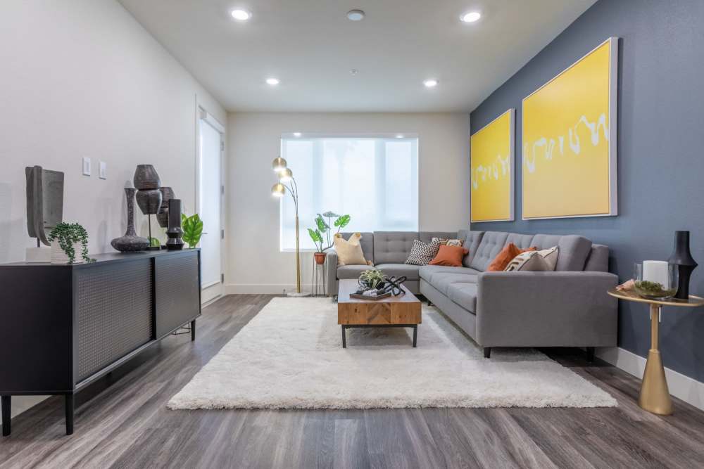 Furnished living room with an accent wall at The Fields in Milpitas, California