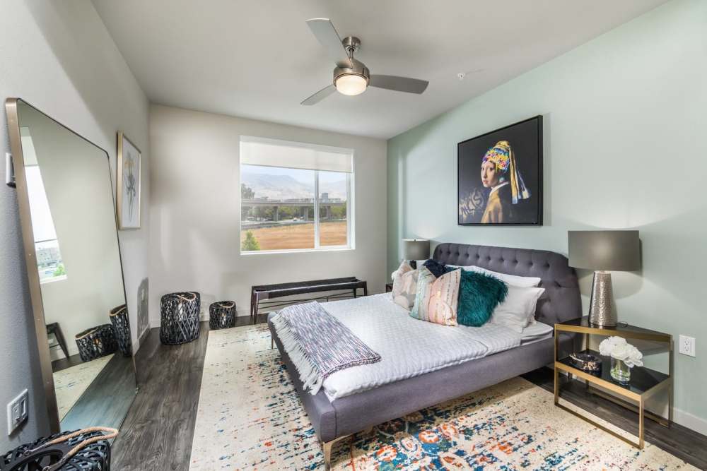 Bedroom with a ceiling fan at The Fields in Milpitas, California