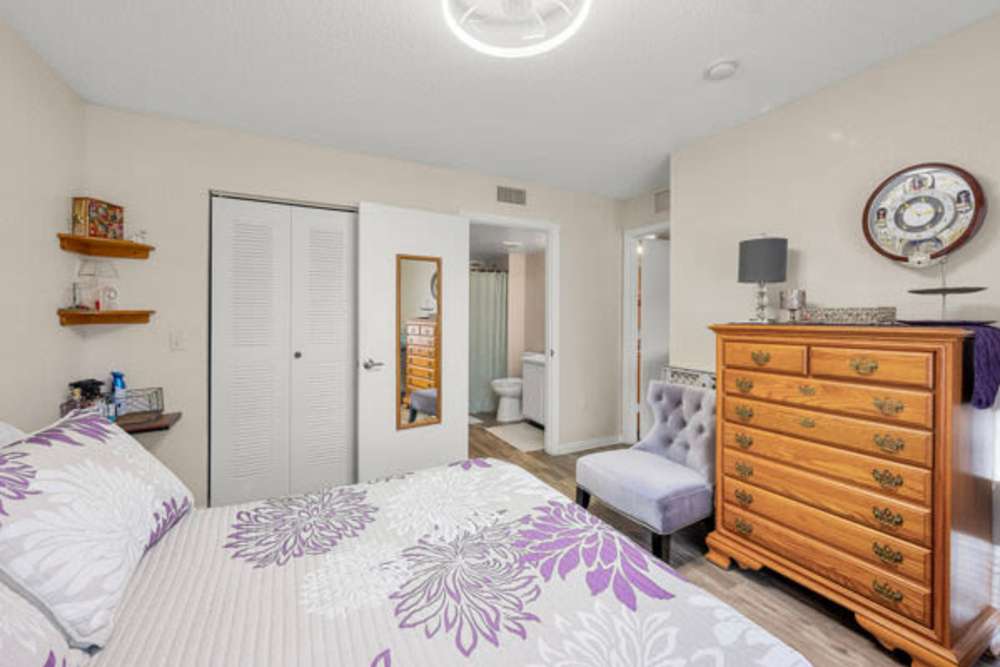 Bedroom with wooden storage units at Pelican Isles Apartments in Sebastian,Florida