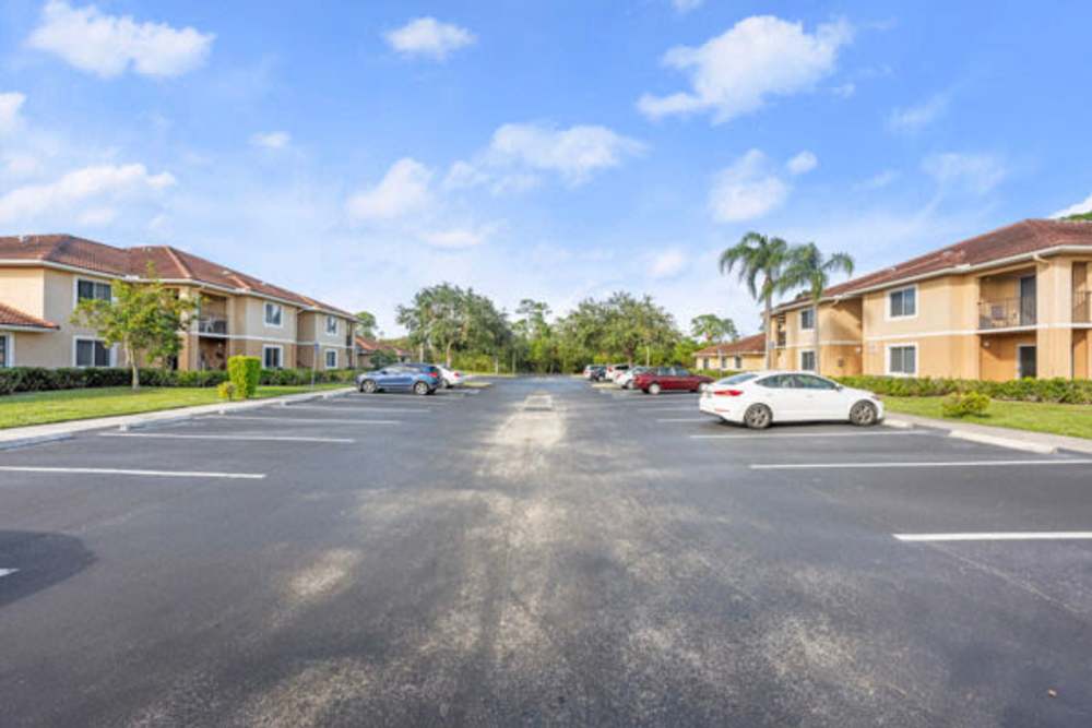Outdoor parking area for the community at Pelican Isles Apartments in Sebastian,Florida