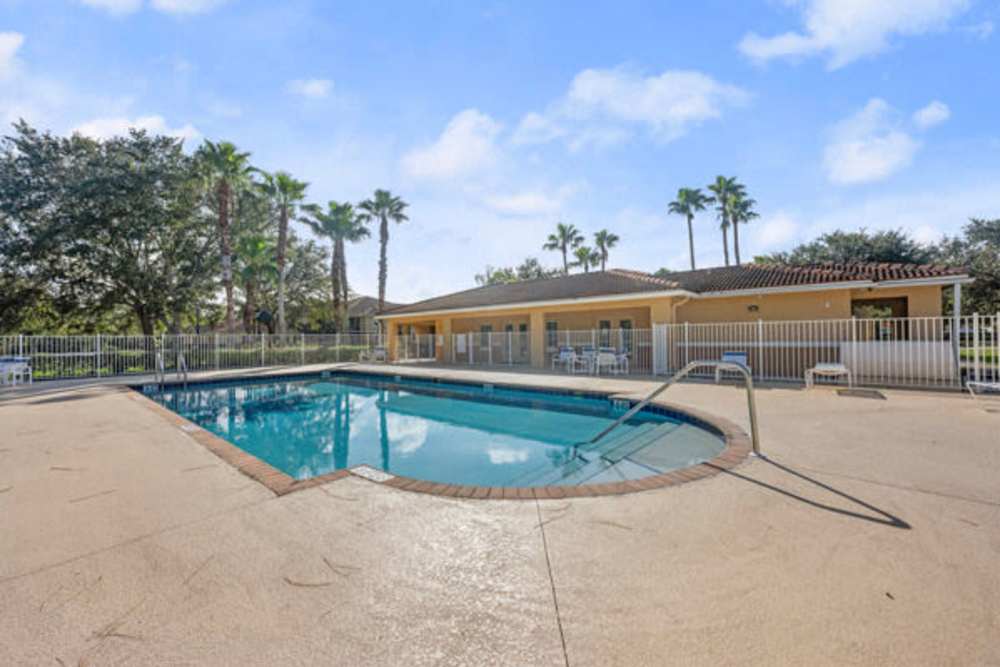 Large shimmering swimming pool at Pelican Isles Apartments in Sebastian,Florida