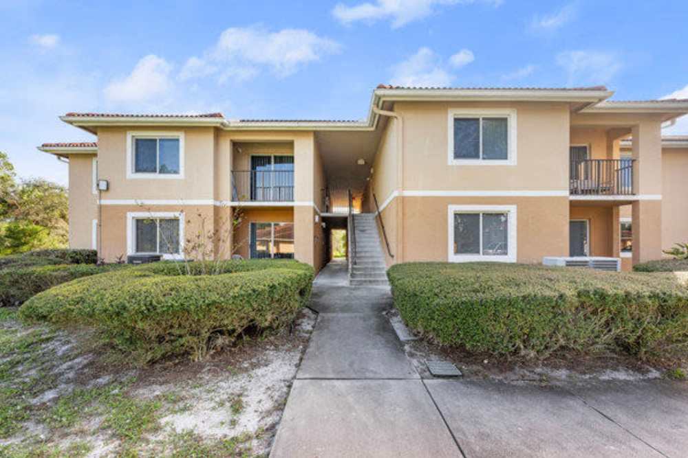 Building exterior with plantation at Pelican Isles Apartments in Sebastian,Florida