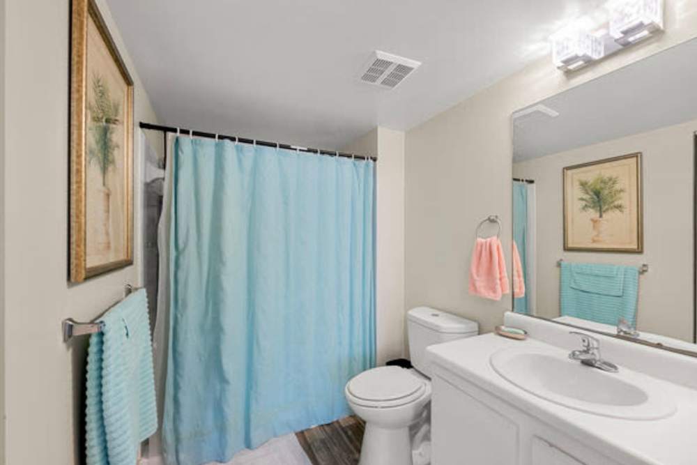 Bathroom with a bathtub and a shower curtain at Pelican Isles Apartments in Sebastian,Florida
