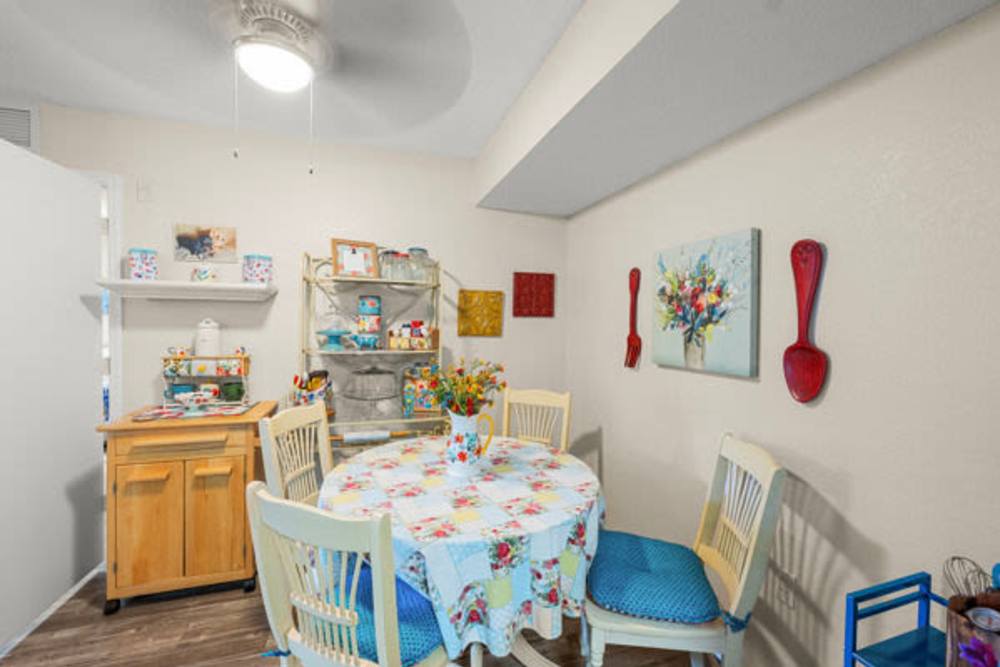 Dining area with a four-seater dining table at Pelican Isles Apartments in Sebastian,Florida