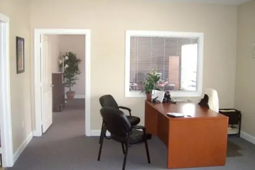 Office room with a table and chairs at Ochlockonee Pointe Apartments in Midway, Florida