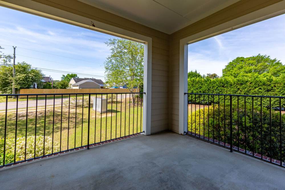 Patio with railing at Amelia Apartments in Fayetteville, North Carolina