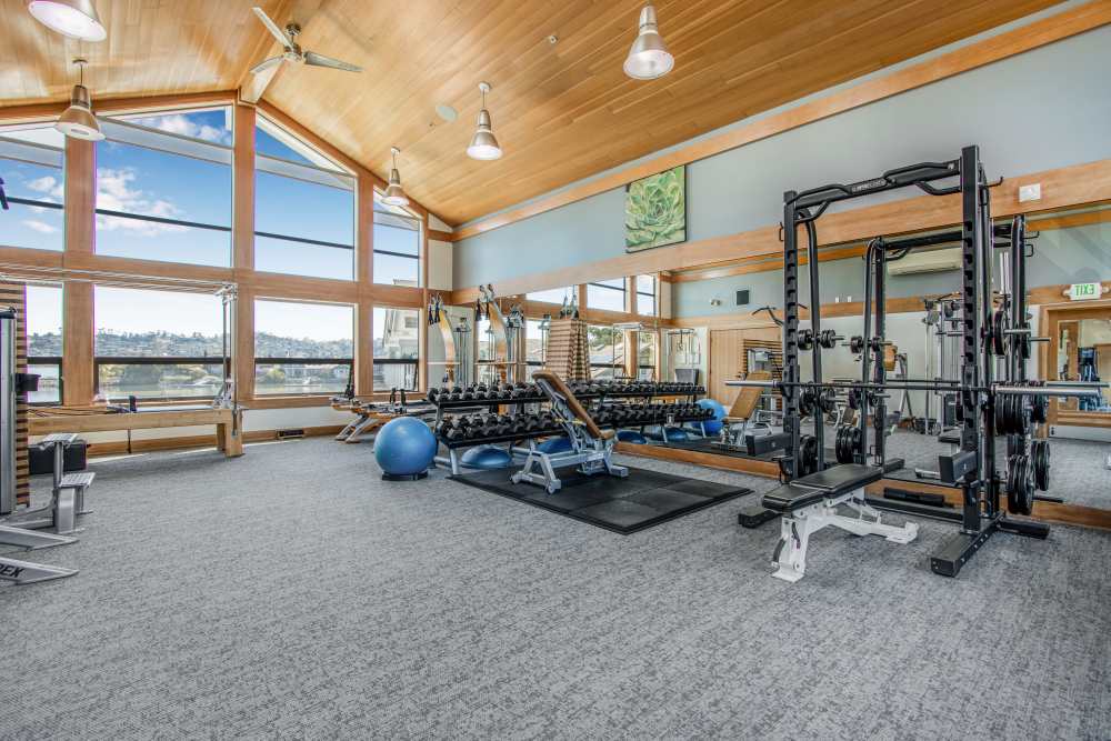 Fitness center with various exercise equipment at Harbor Point Apartments in Mill Valley, California