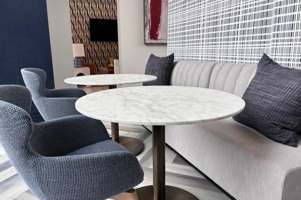 Lounge area with round table at The Landing Lawrence in Lawrence, Kansas