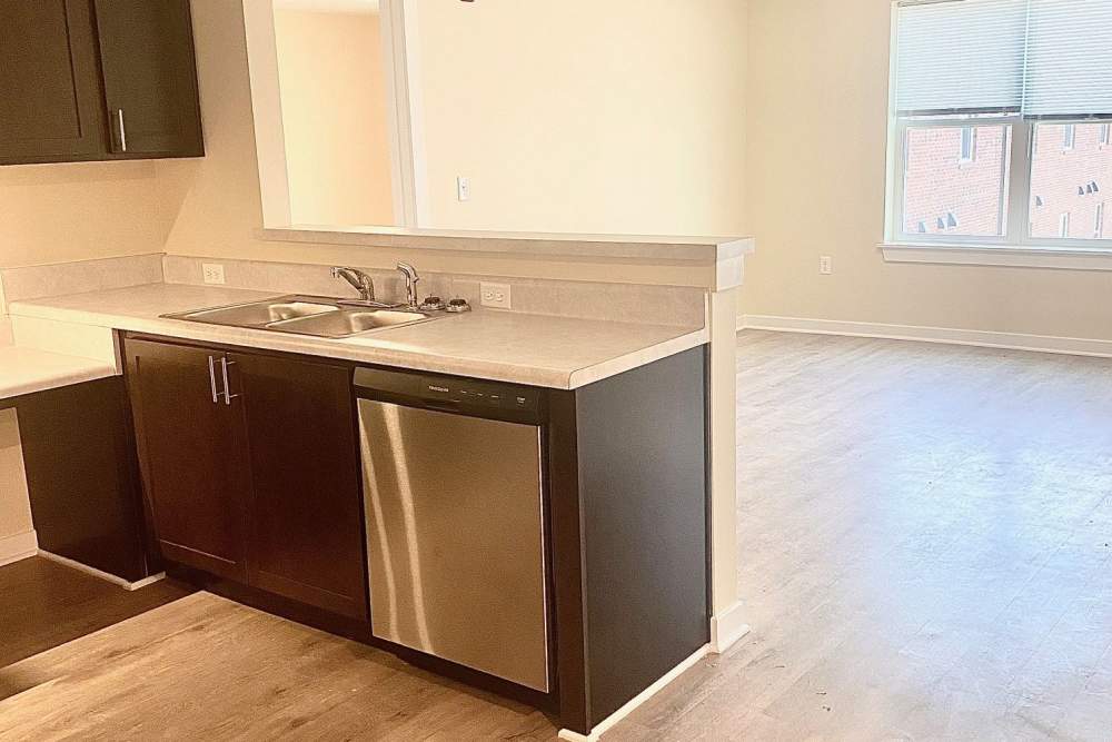 Kitchen with a dishwasher at Saratoga Place Apartments in Suffolk, Virginia