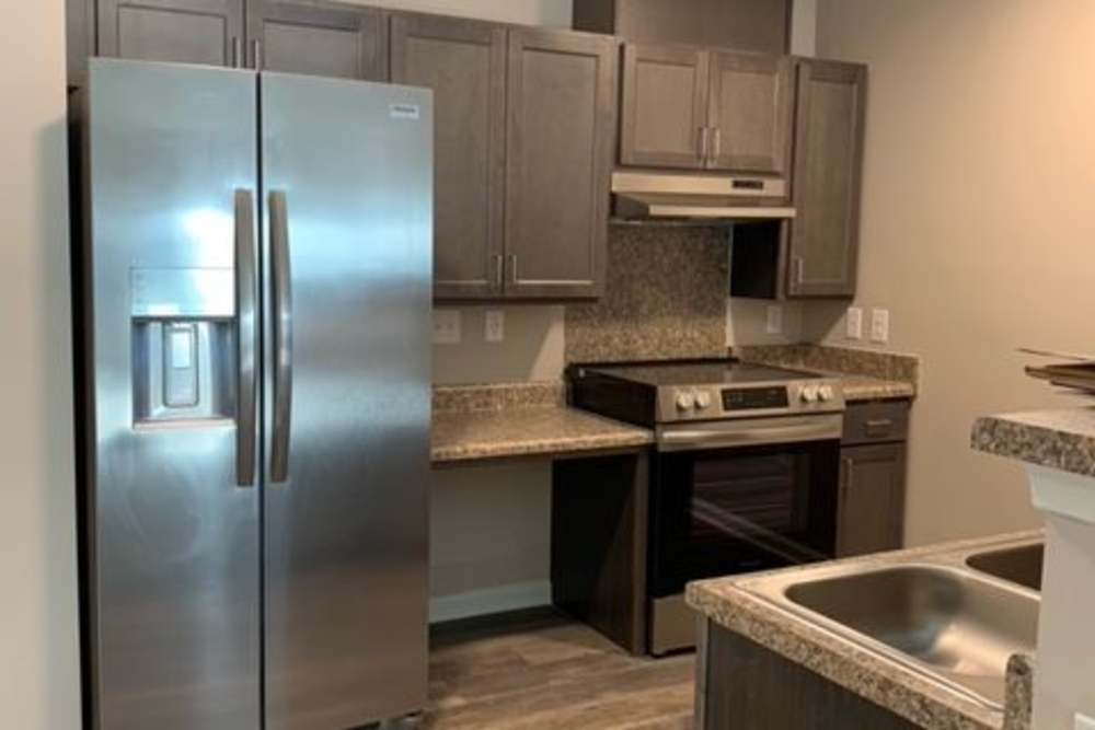 Kitchen in a home at Grande Oak Apartments in Williamsburg, Virginia