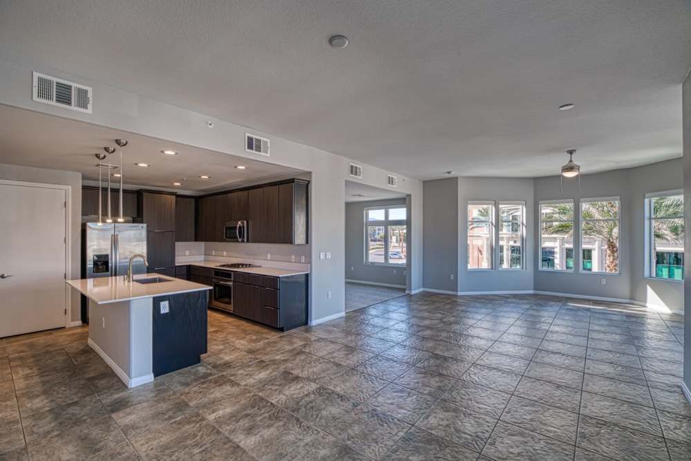 Spacious living room with modern kitchen at The Gramercy Residences in Las Vegas, Nevada