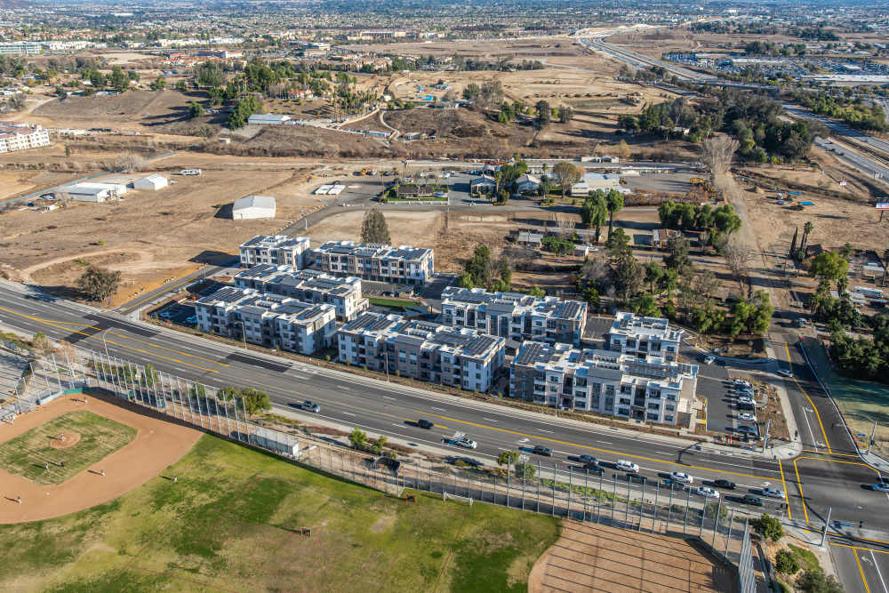 Overhead view of a residential area in the city at Monamos Terrace Apartments in Murrieta, California