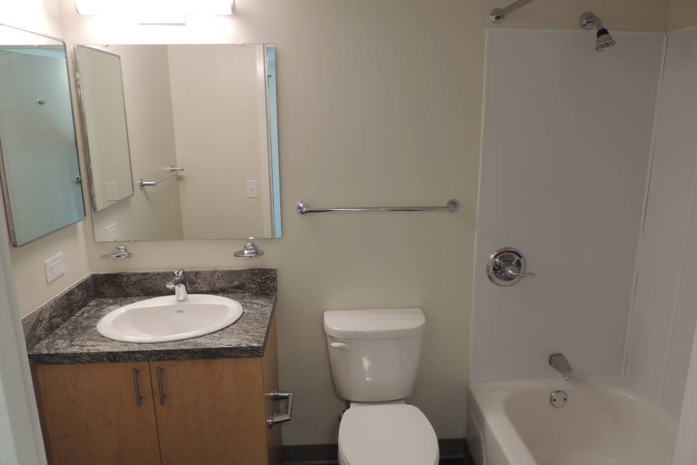 Bathroom with a shower and tub at Capital Towers in Raleigh, North Carolina