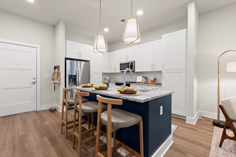 Dining area and kitchen at EVOQ East Cobb in Marietta, Georgia