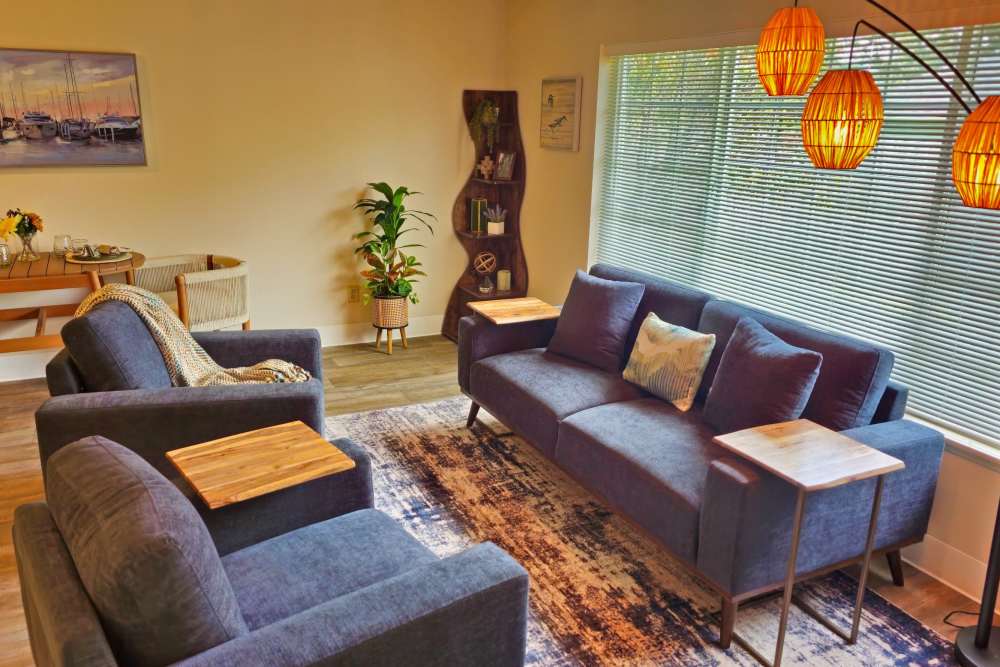 A spacious living room with two comfortable couches and a central table at Neawanna By The Sea in Seaside, Oregon