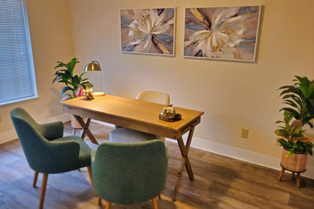 An office space with two chairs and a desk, designed for a minimalistic work setting at Neawanna By The Sea in Seaside, Oregon