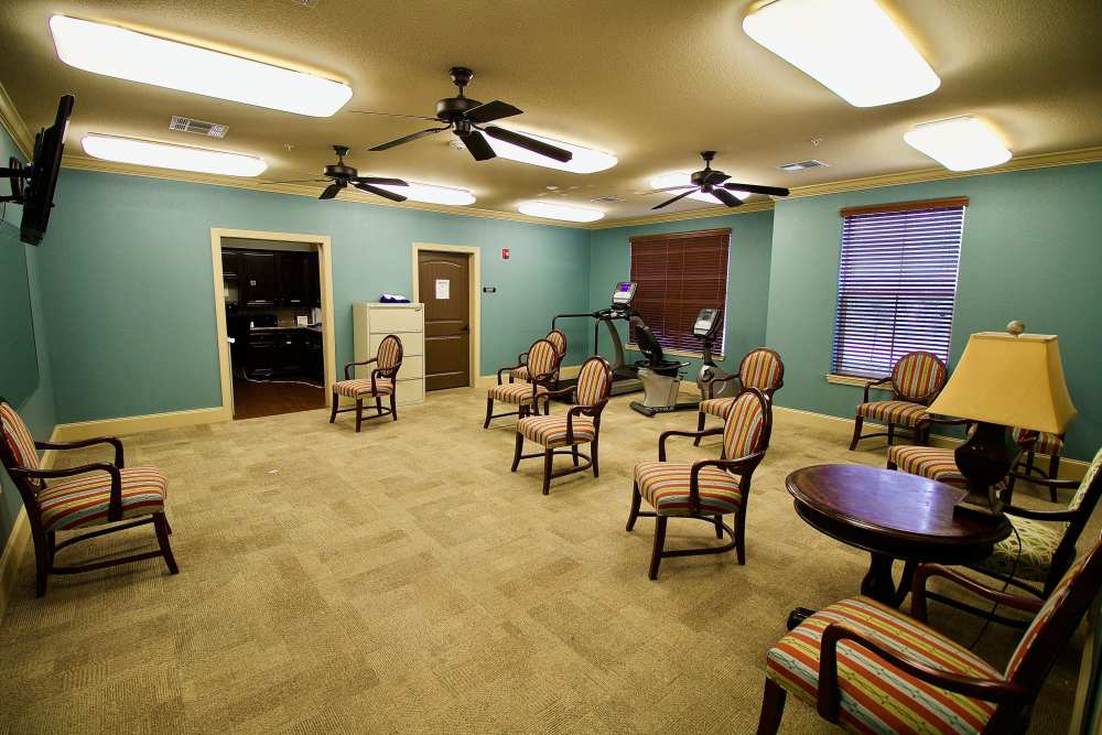 A resident playing piano at Isle at Watercrest Mansfield in Mansfield, Texas