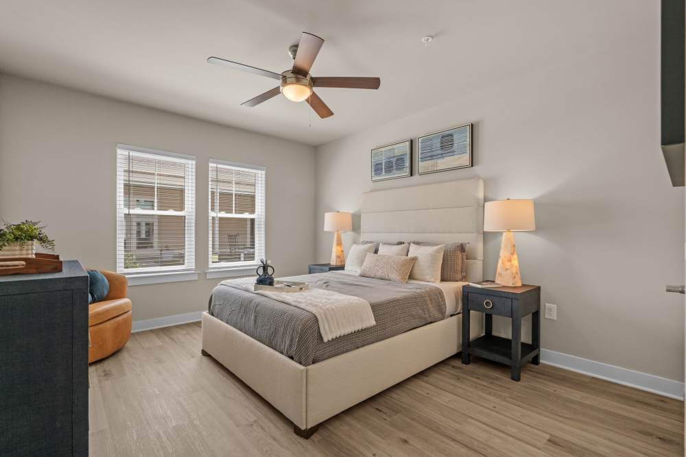 Model bedroom with walk-in closet at The Edison at Farrow Commons in North Myrtle Beach, South Carolina