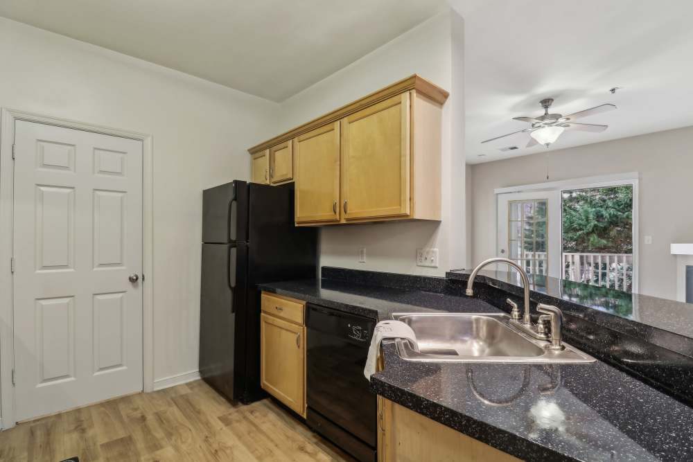 Kitchen with black color appliance at Malvern Lakes Apartments in Fredericksburg, Virginia 