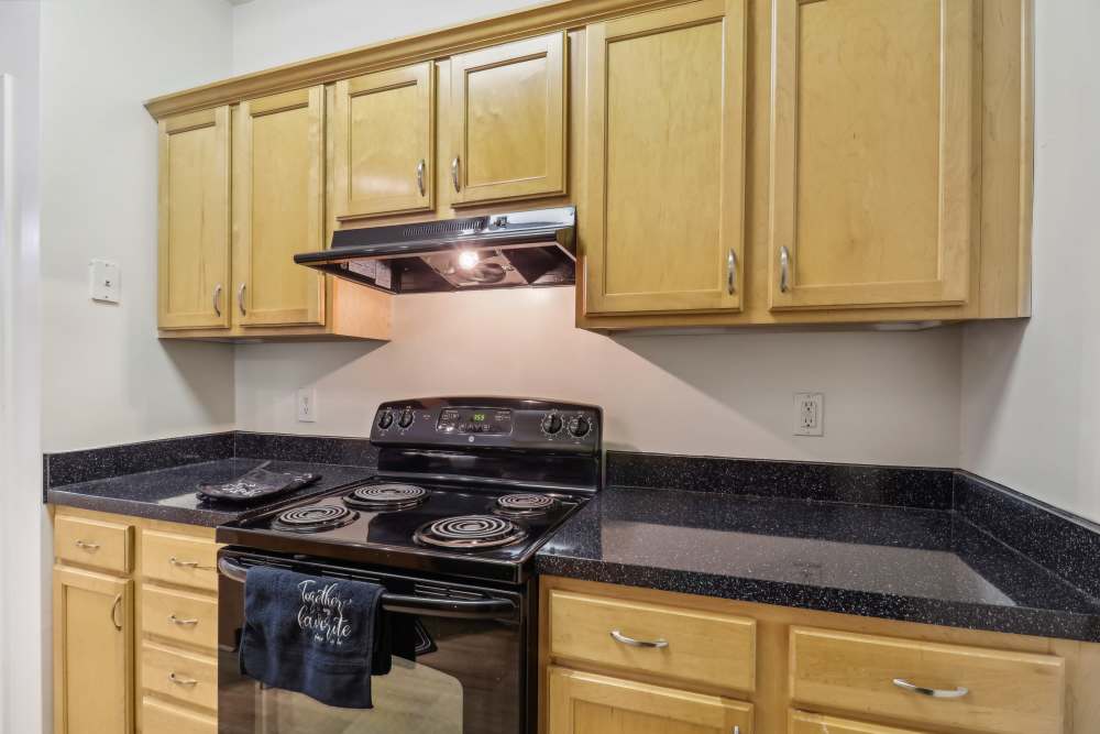 Kitchen with granite countertop at Malvern Lakes Apartments in Fredericksburg, Virginia 