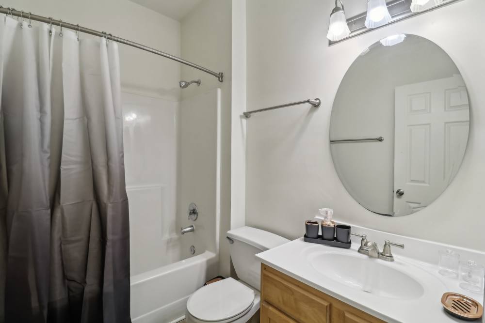 Bathroom with fancy vanity mirror at Malvern Lakes Apartments in Fredericksburg, Virginia 