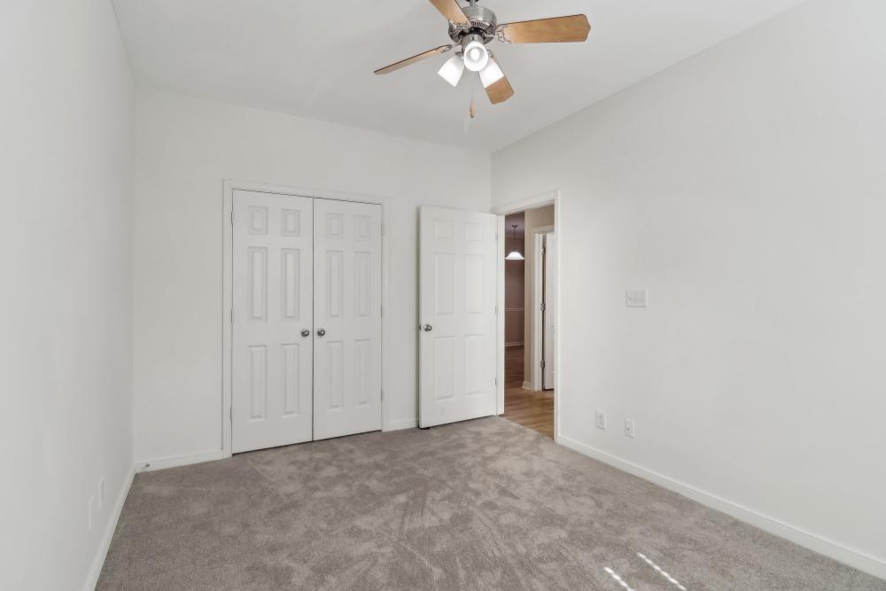 Unfurnished bedroom with carpet flooring at Malvern Lakes Apartments in Fredericksburg, Virginia