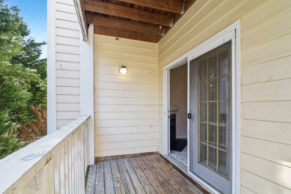 Patio with wooden flooring at Malvern Lakes Apartments in Fredericksburg, Virginia