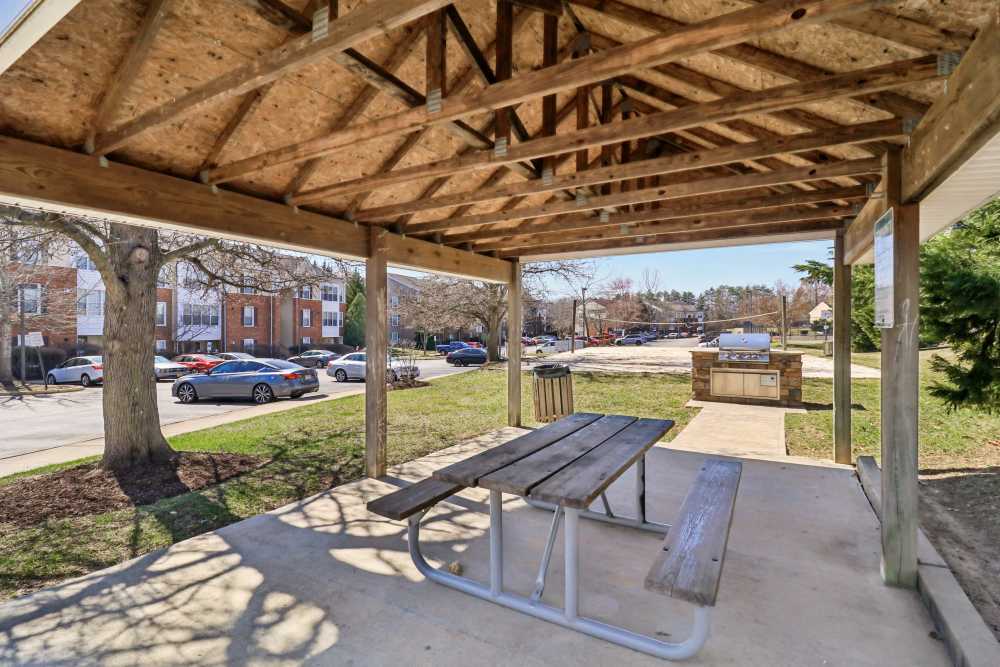 Outside shaded seating area at Malvern Lakes Apartments in Fredericksburg, Virginia