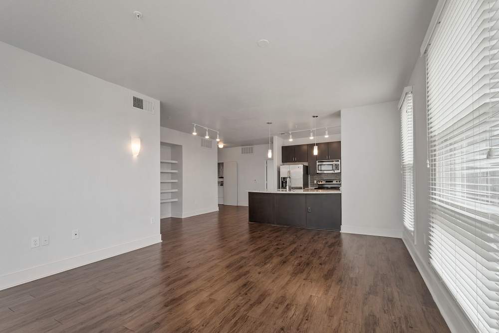 Spacious living room with wooden flooring at The Lofts At West 7th in Fort Worth, Texas