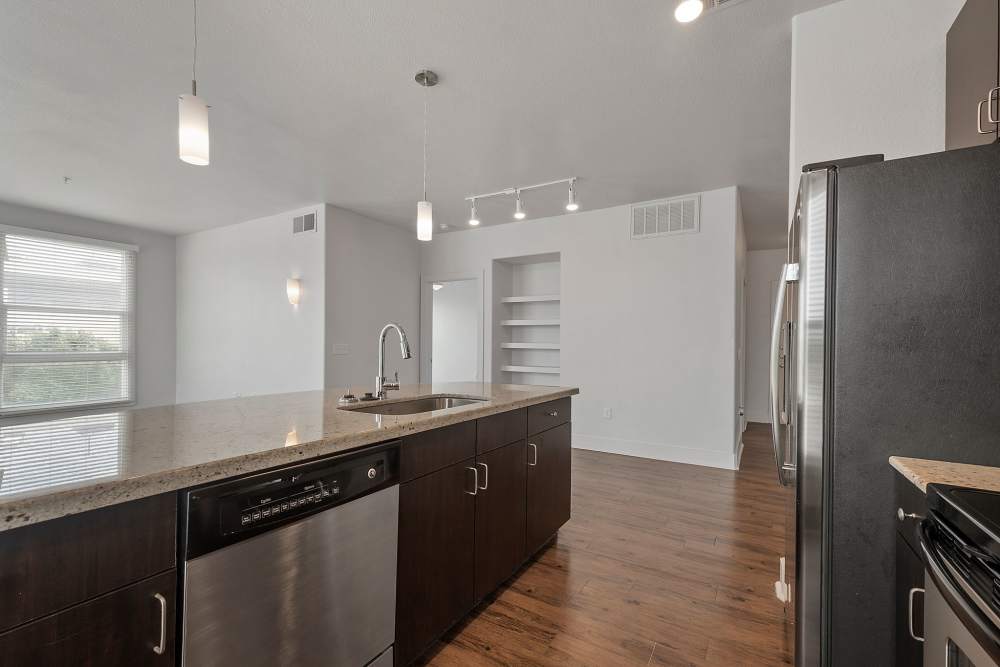 Fully equipped kitchen with appliances at The Lofts At West 7th in Fort Worth, Texas