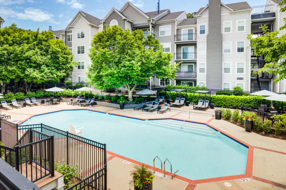 Resort style pool with lounge chairs at Knoll at Fair Oaks, Fairfax, Virginia