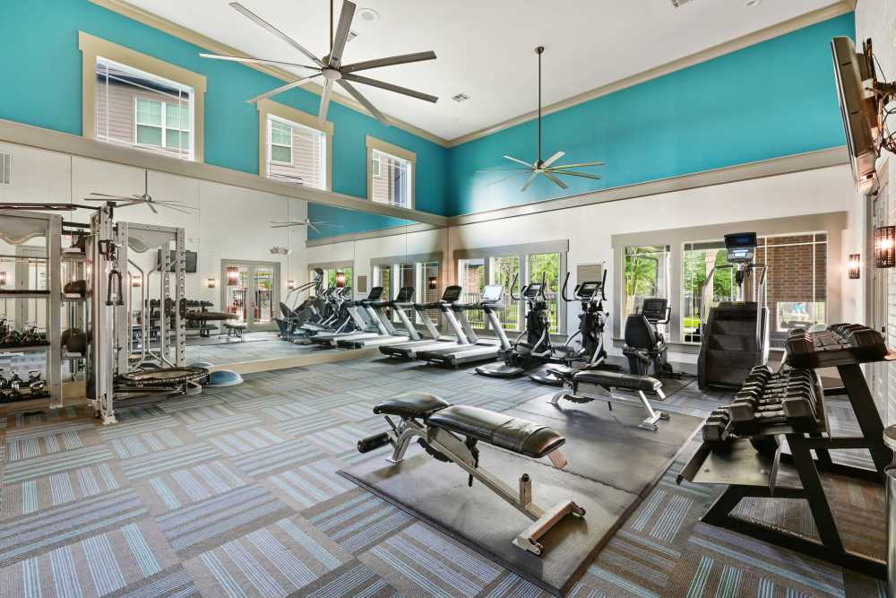 Fitness centre with ceiling fan at Beacon Lakes in Dickinson, Texas