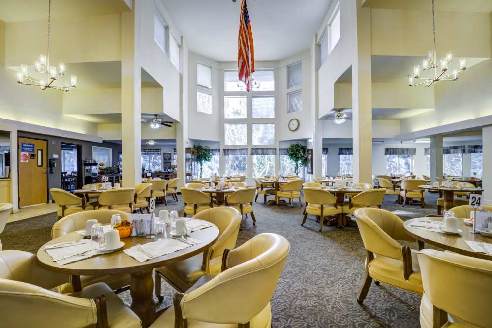 Dining hall with table setting at Truewood by Merrill, Fig Garden in Fresno, California