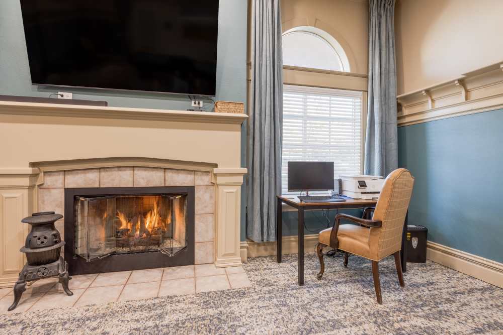 Fireplace beside a computer desk at Truewood by Merrill, Vancouver in Vancouver, Washington