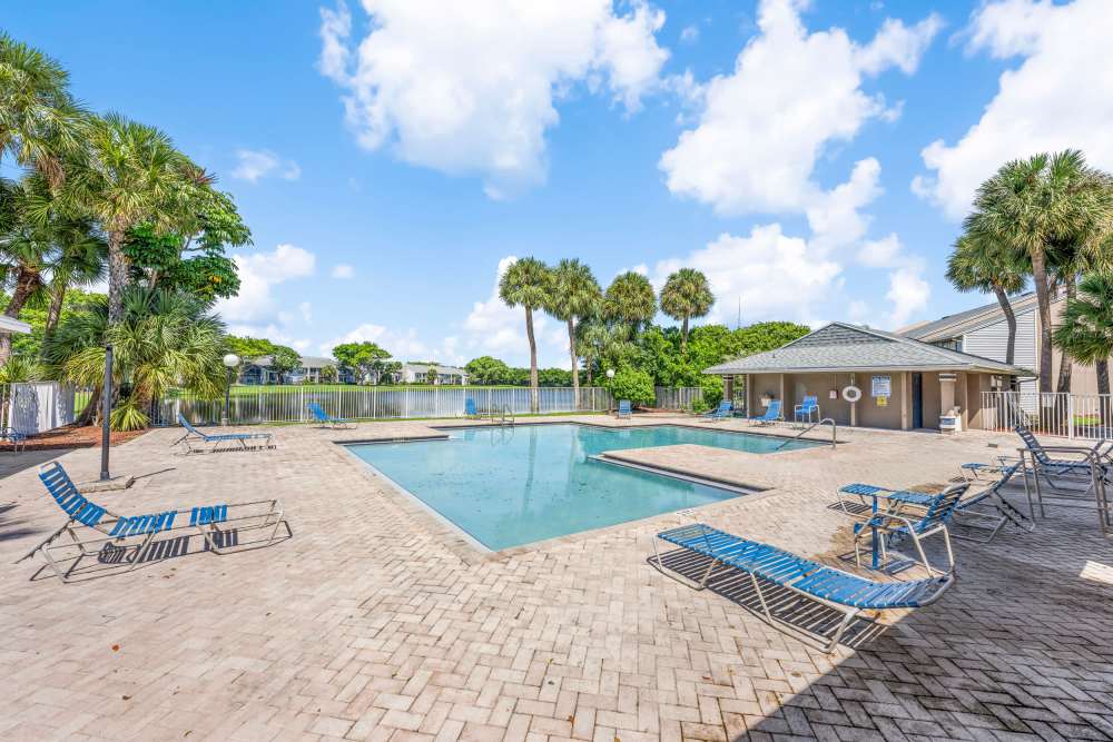 Swimming pool with sun decks at Clipper Cove Apartments in Boynton Beach, Florida