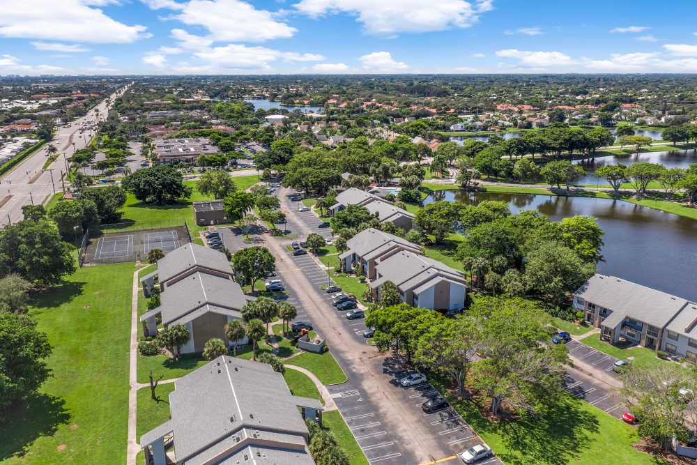 Aerial shot of community with lake view at Clipper Cove Apartments in Boynton Beach, Florida