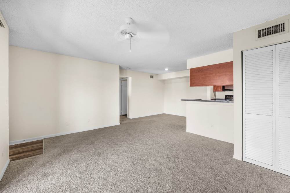 Living room with ceiling fan at Clipper Cove Apartments in Boynton Beach, Florida