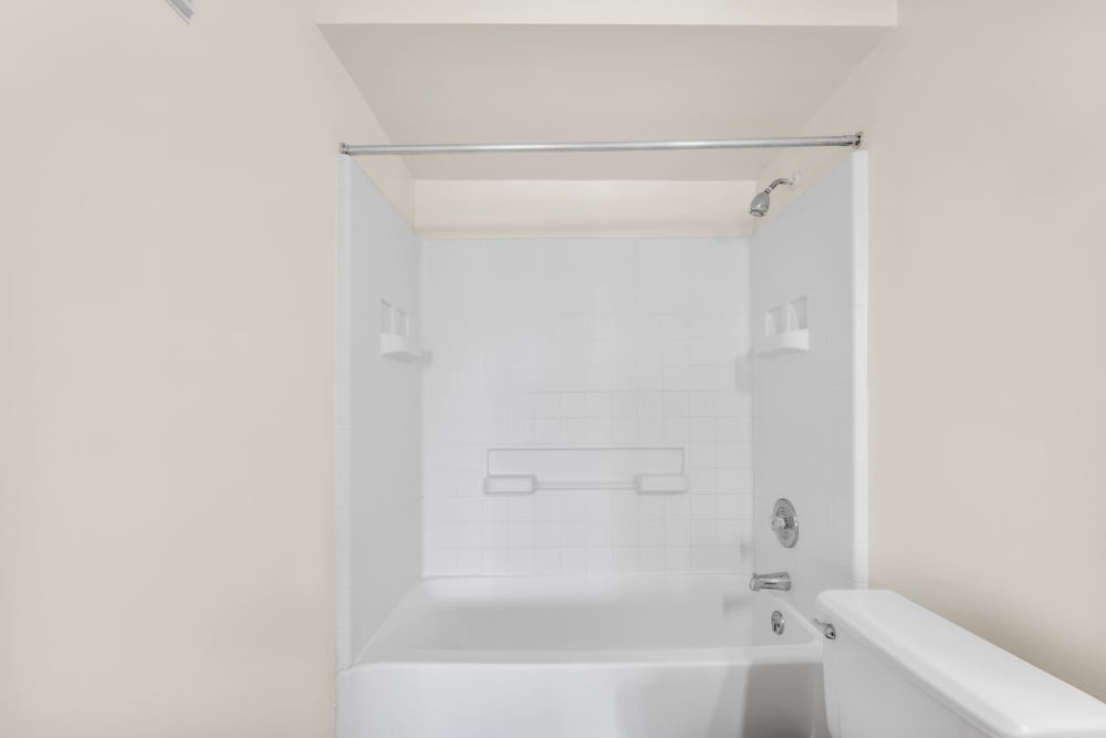Bathroom with tub at Clipper Cove Apartments in Boynton Beach, Florida