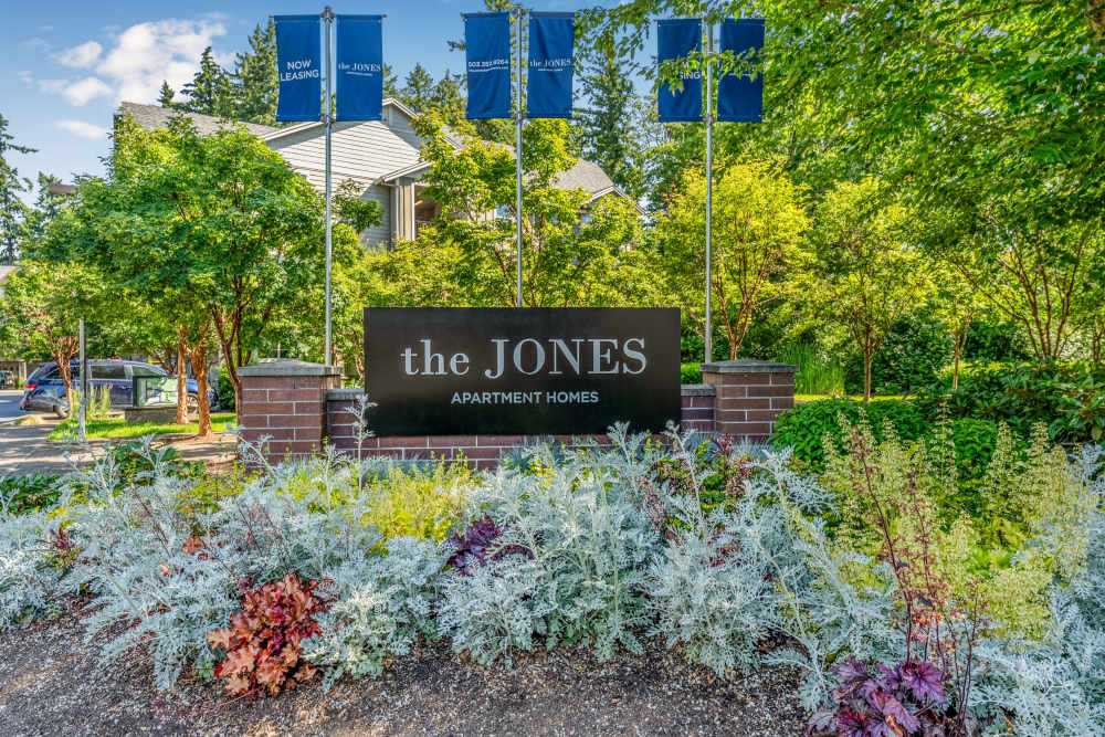Exterior with flowers and manicured landscaping at The Jones in Hillsboro, Oregon